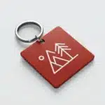 Red keychain with abstract mountain design
