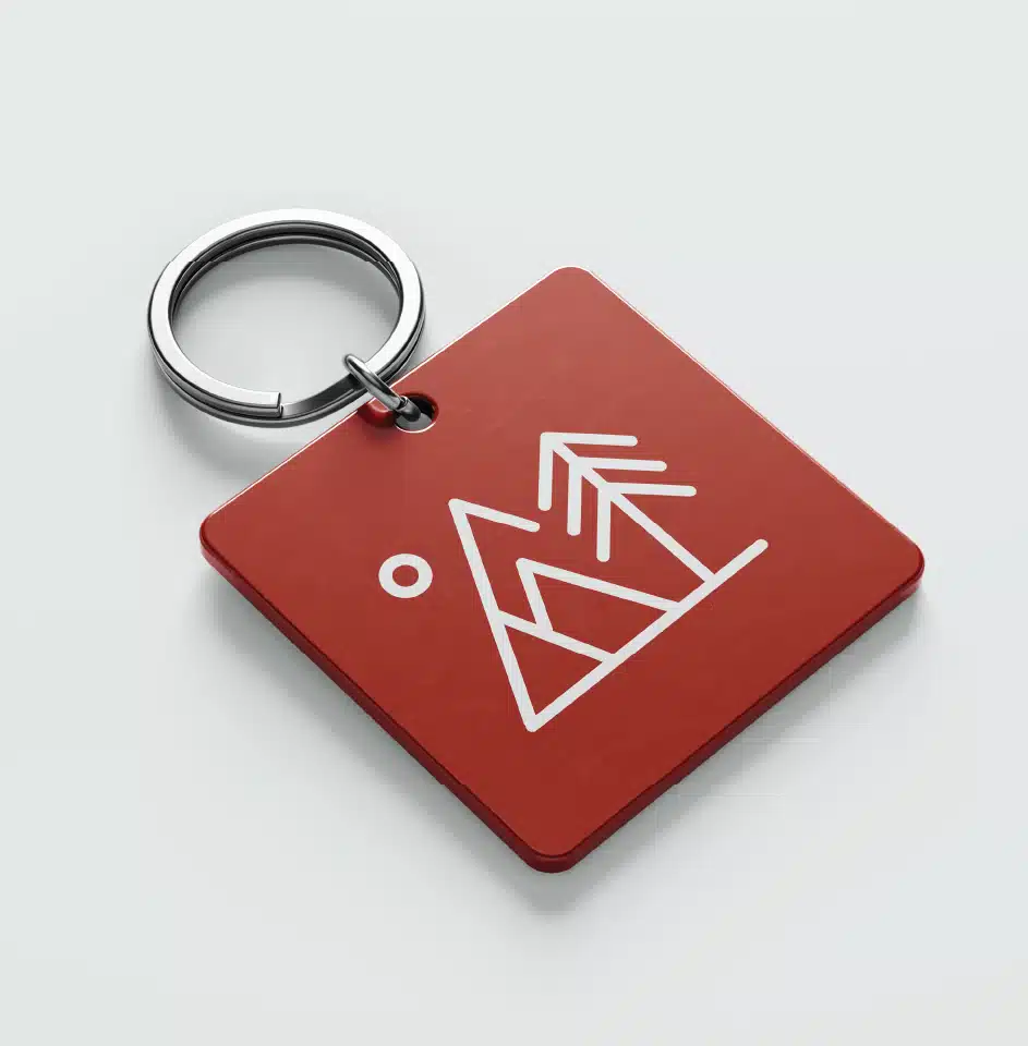 Red keychain with abstract mountain design