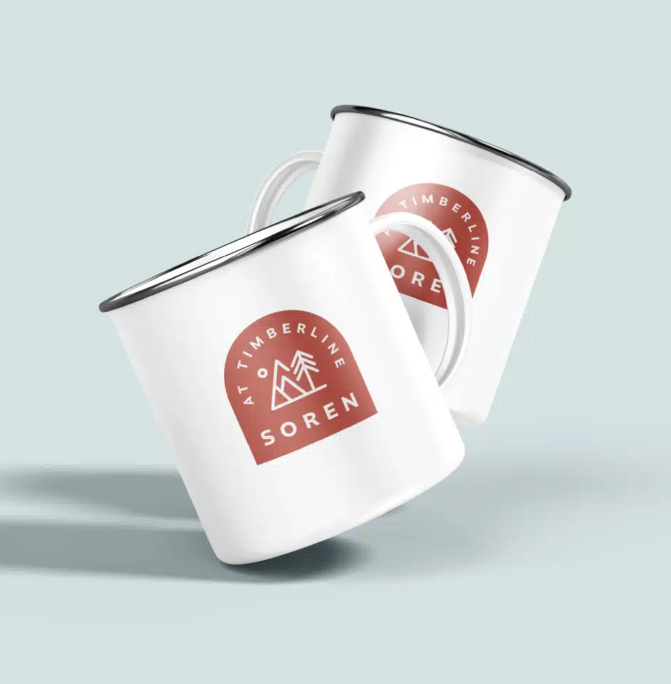White enamel mugs with Soren logo.