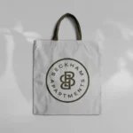 Beckham Apartments logo on a white shopping bag.