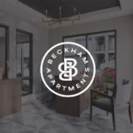 Modern office interior with logo overlay.