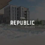 Modern apartment building with a pool view.