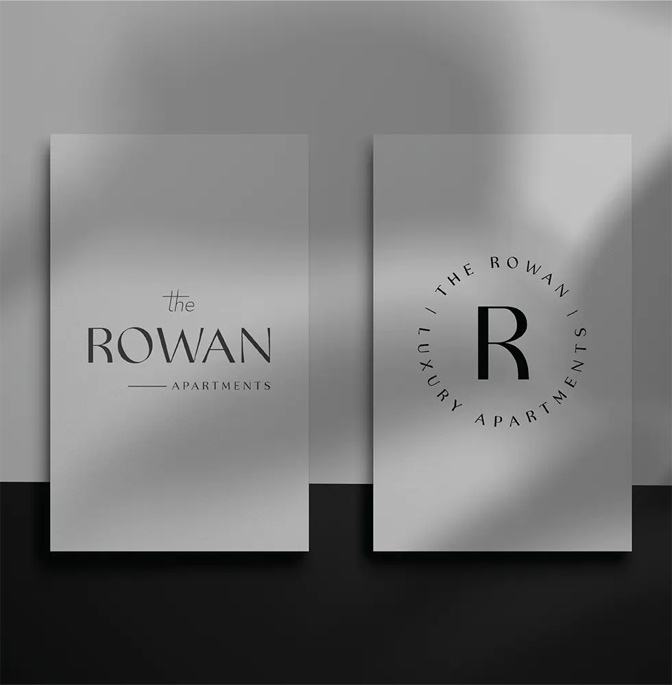 Rowan Apartments logo designs on display.
