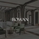 Modern hotel lobby with green chairs.