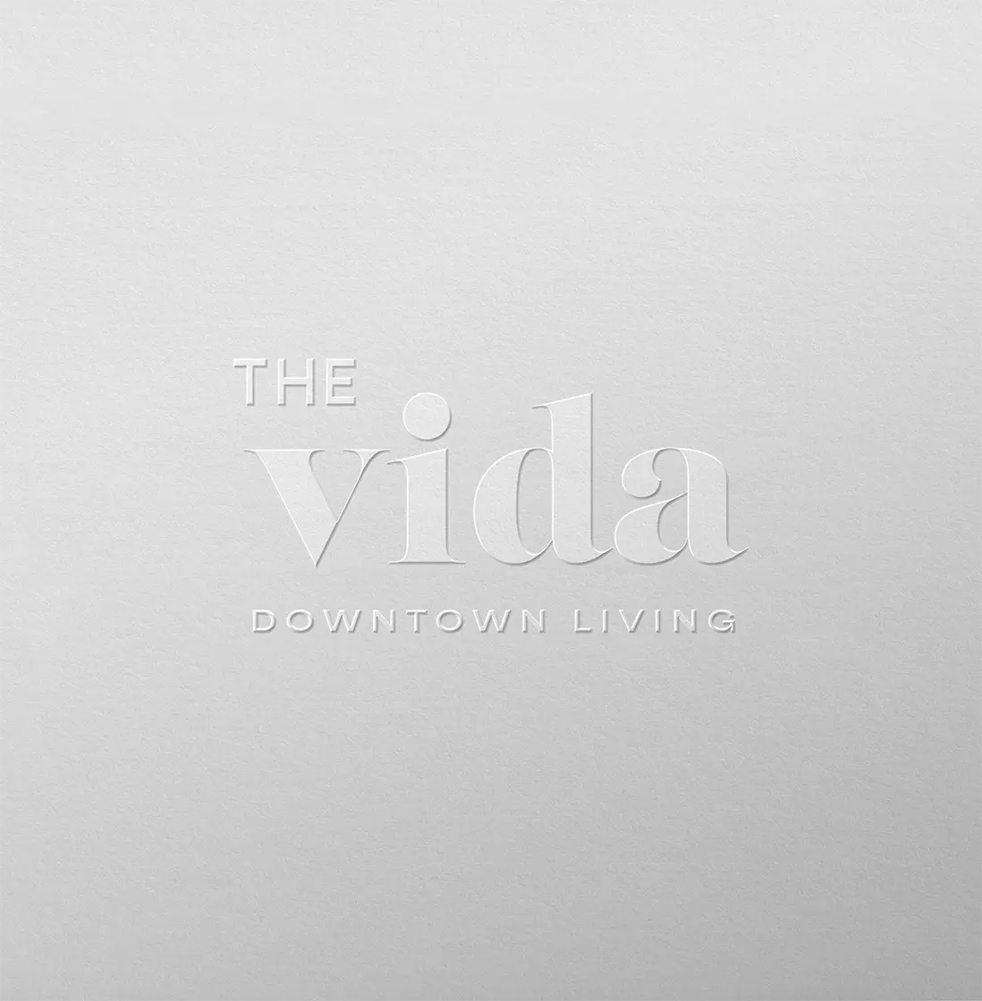 The Vida Downtown Living logo on textured background