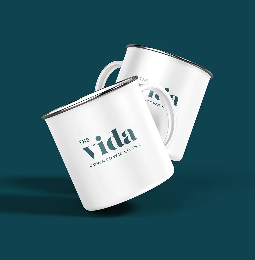 Two mugs with 'The Vida' branding.