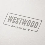 Westwood Apartments logo on textured paper