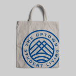 Canvas tote bag with Uptown Student Living logo.
