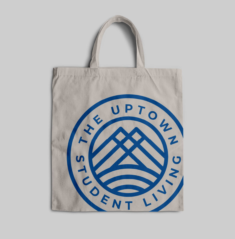 Canvas tote bag with Uptown Student Living logo.
