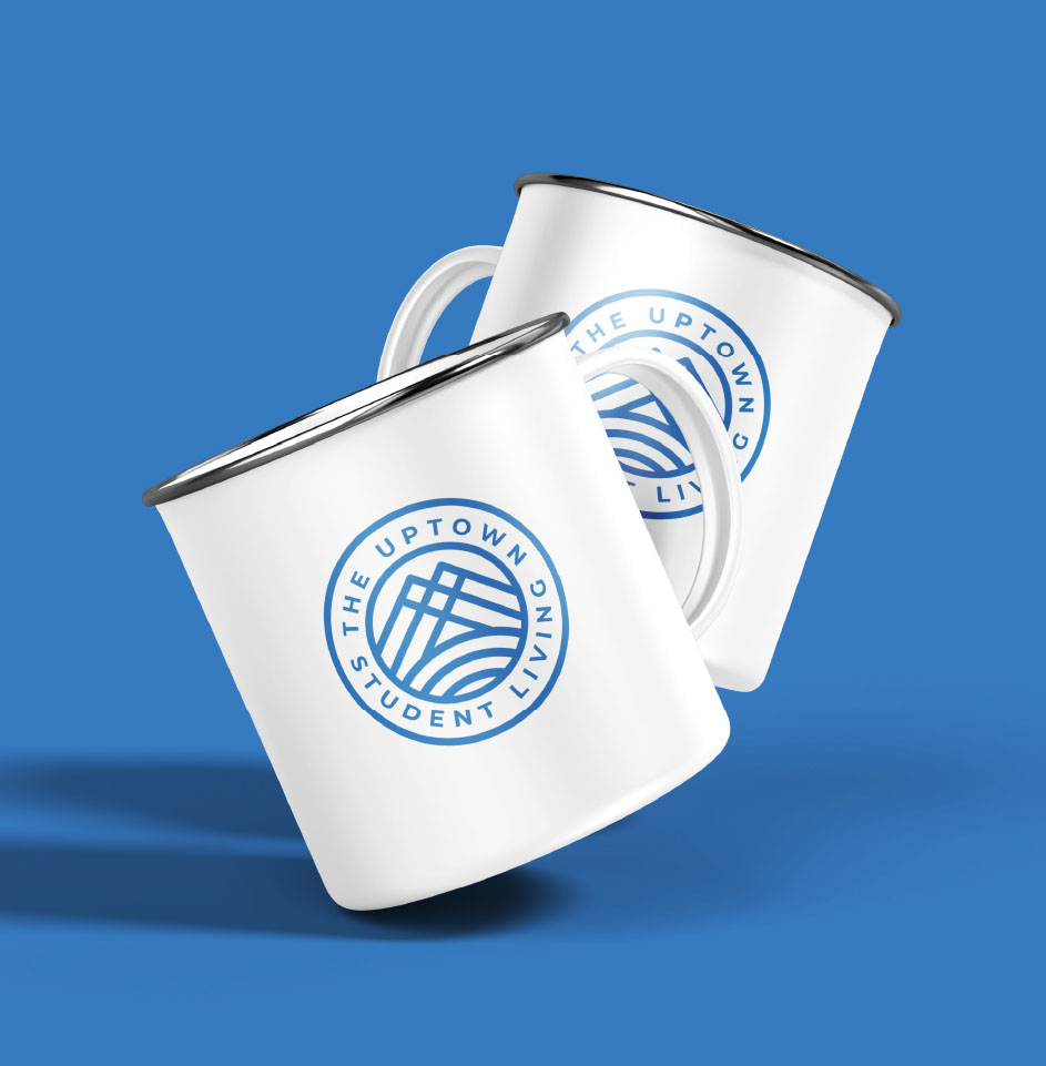 Two white mugs with Uptown Student Living logo.