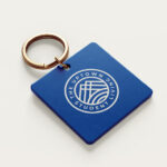 Blue keychain with Uptown Student Living logo.