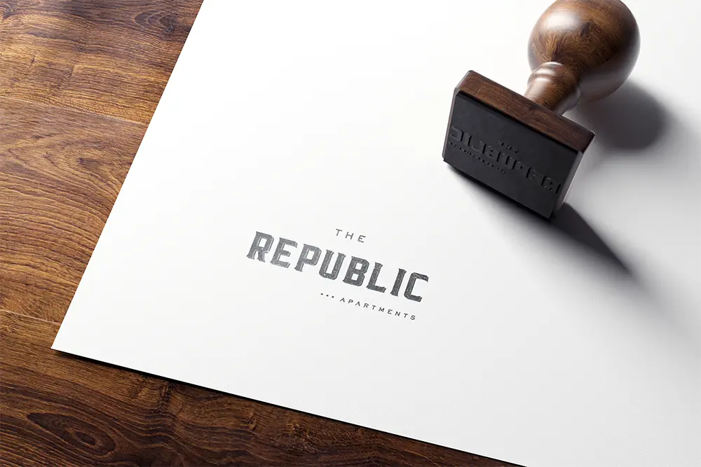 Rubber stamp with The Republic Apartments logo