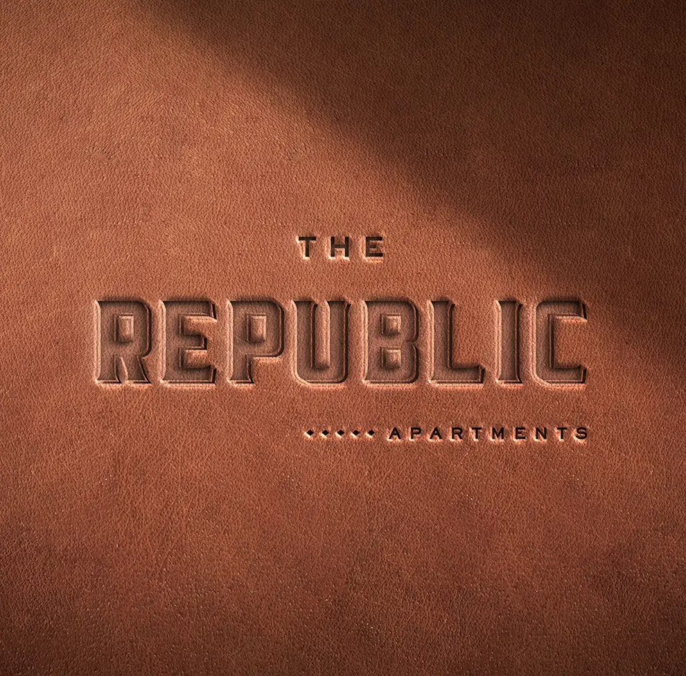 Leather-textured logo for The Republic Apartments.