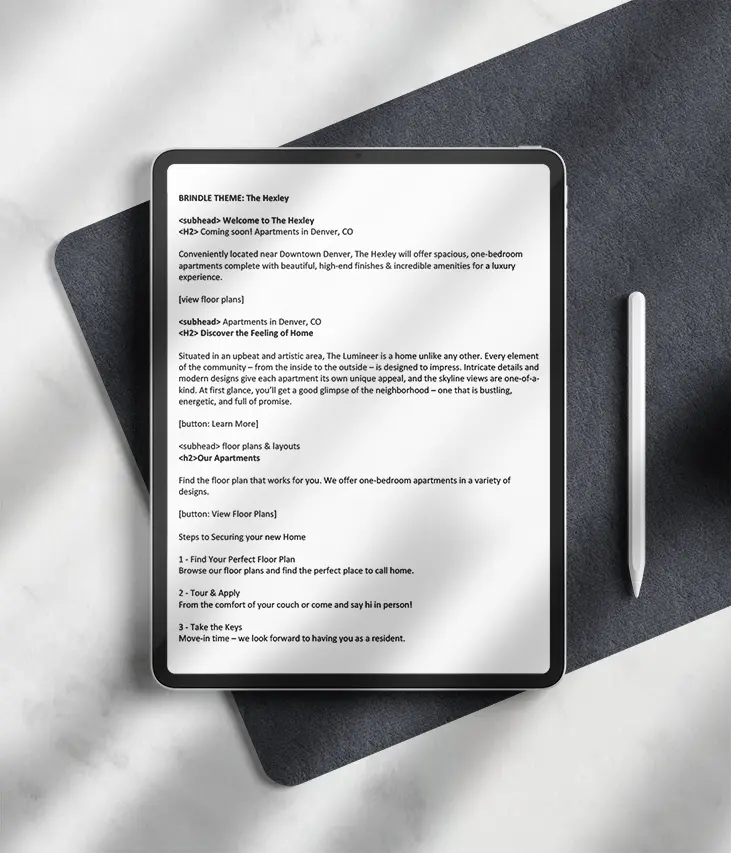 Tablet displaying Denver apartment marketing brochure.